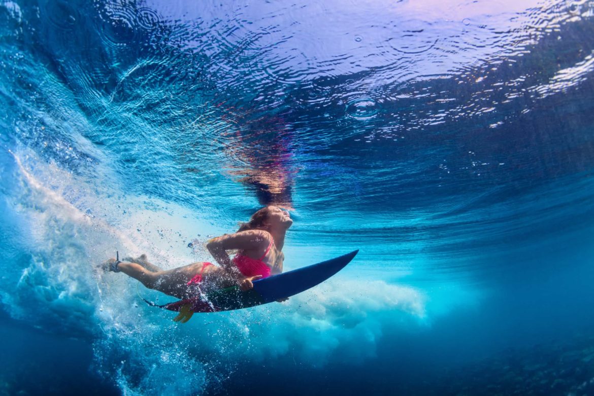 bikini surf surfer underwater summer ocean water wave extreme under lifestyle sport camp swim young vacation wearing action dive adventure
