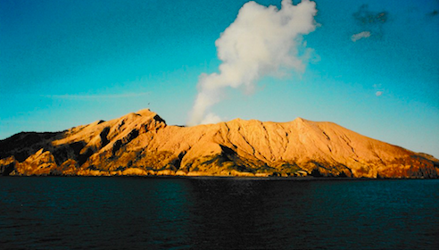Smoke rising from a volcanic crater